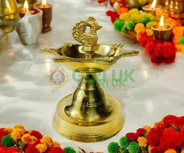 Seven-faced Vilakku with Annapakshi - brass